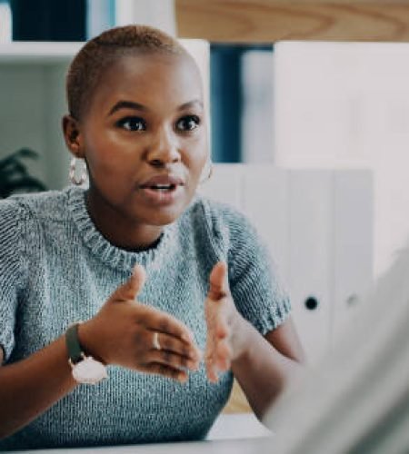 Value Added Services shot of a young businesswoman having a discussion with a colleague in an office