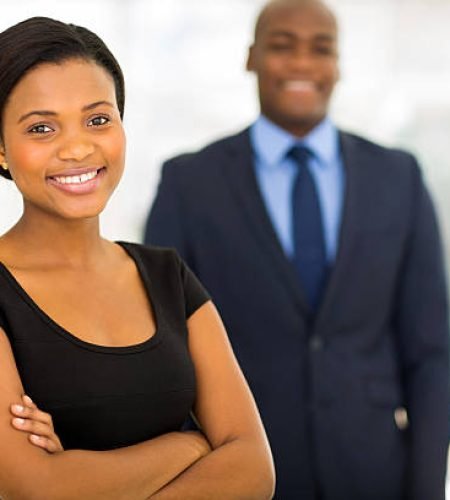 beautiful young african businesswoman standing in front of her colleague