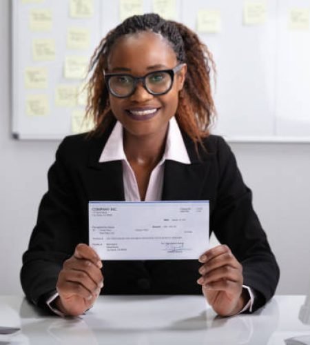 Value Added Services close up of a smiling businesswoman showing company cheque